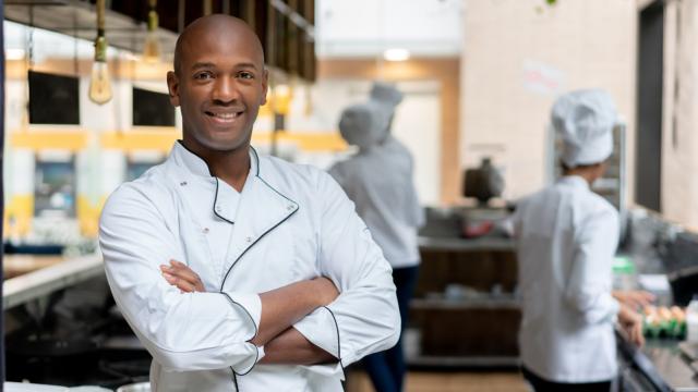 Man standing in restaurant kitchen