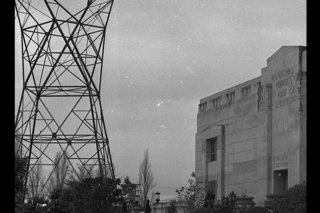 Power transmission tower next to a building