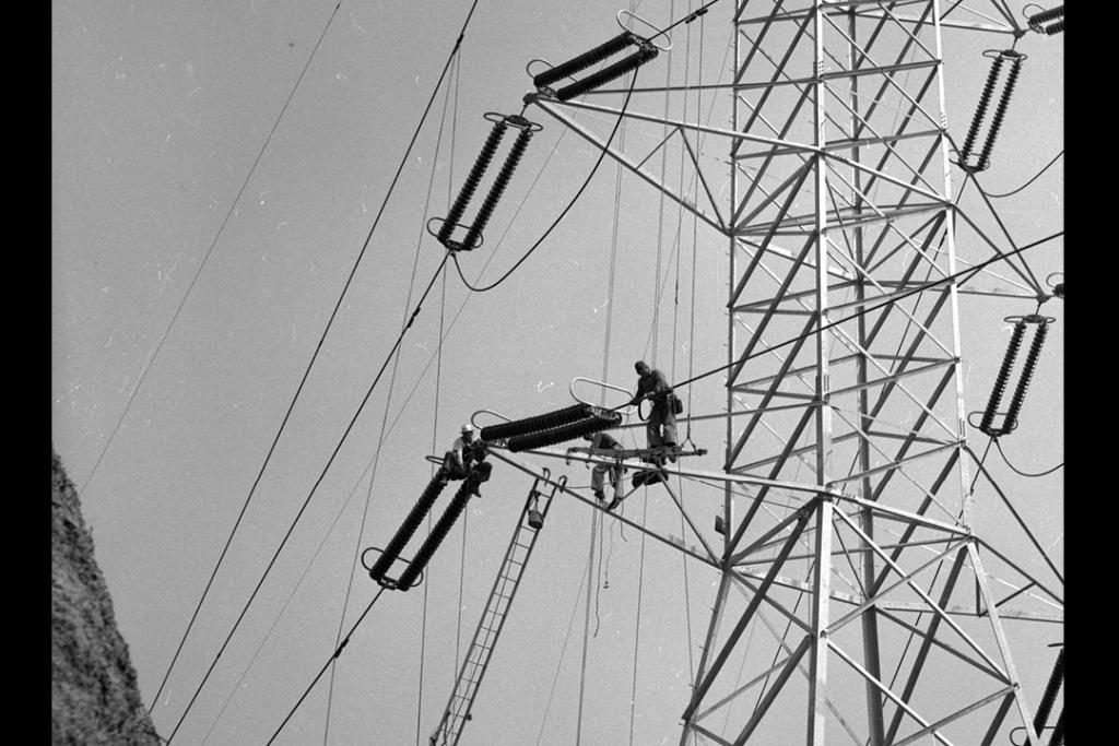 Upward view of power transmission tower