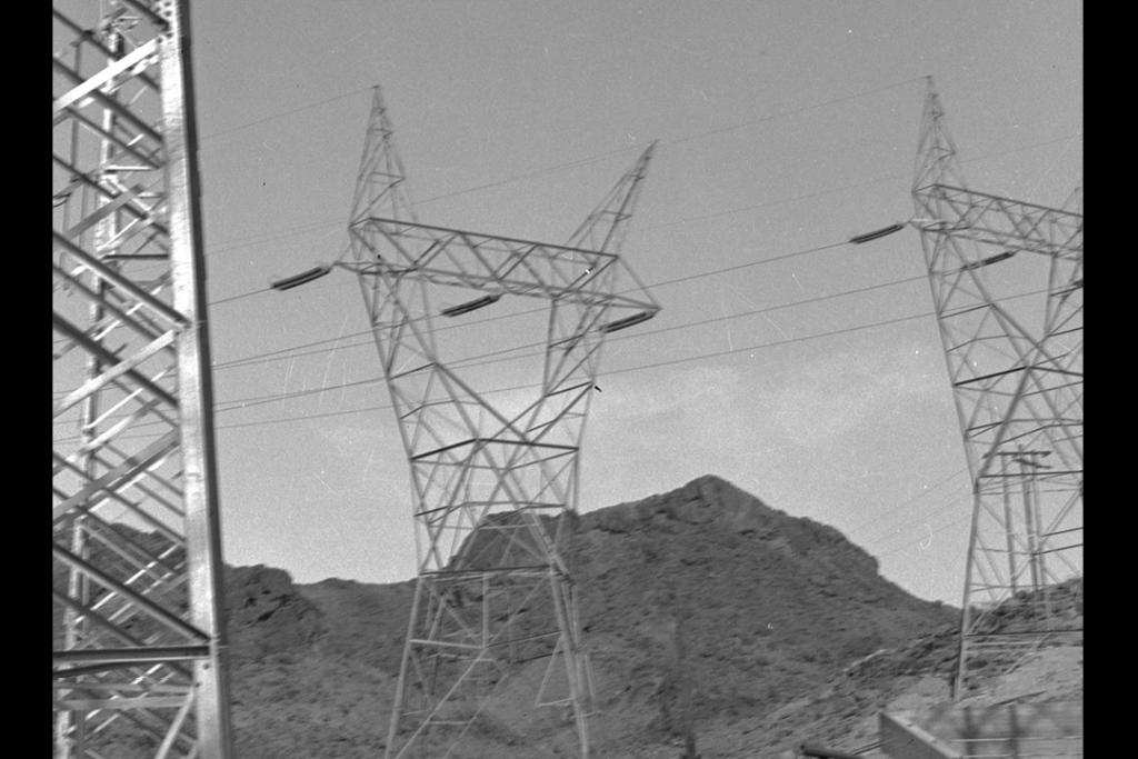 Power transmission lines framed by scaffolding
