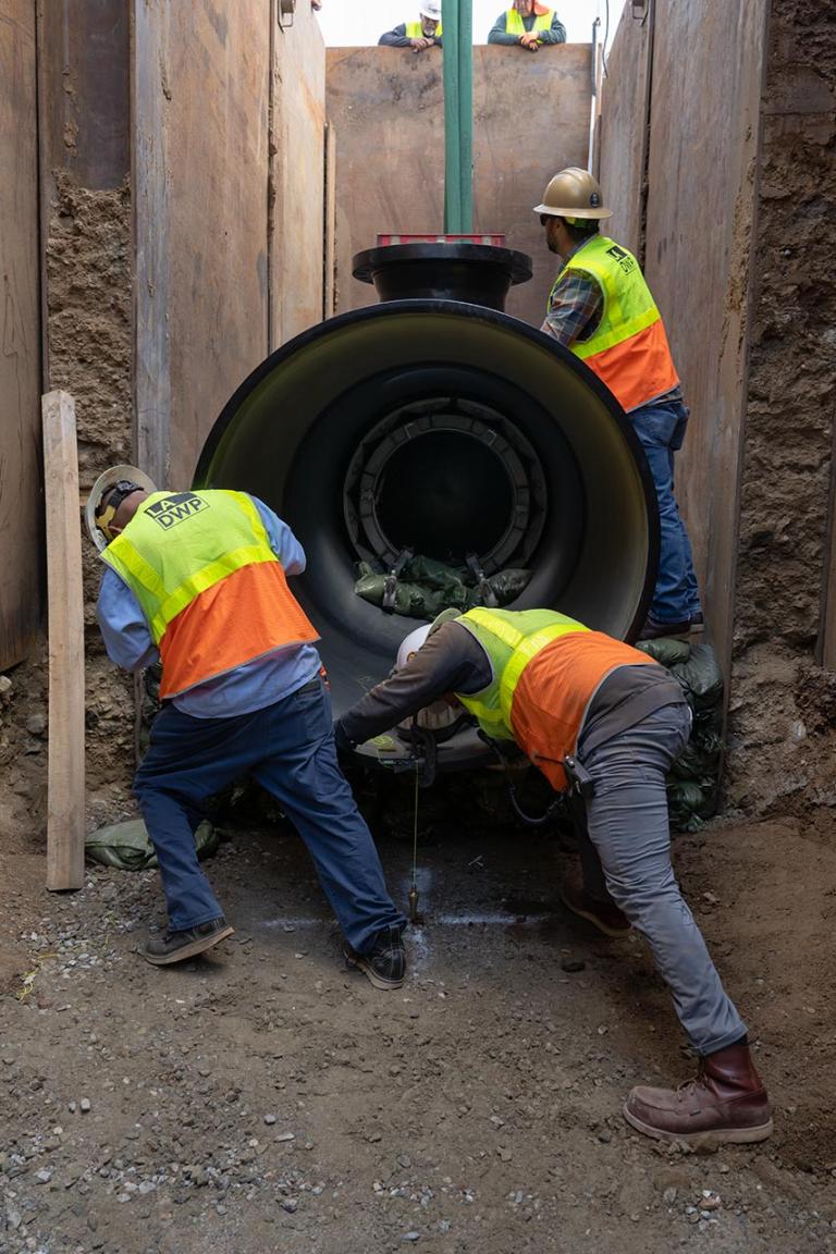 Water construction crew installing a water line.
