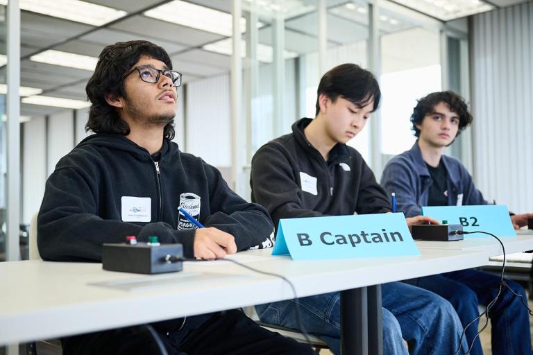 Three Science Bowl contestants sitting