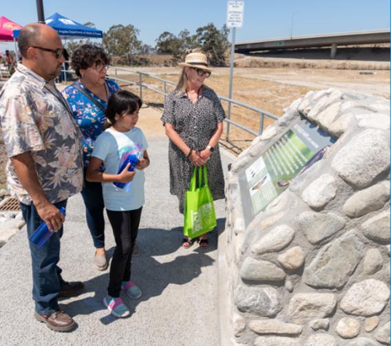 Los Angelinos reading Tujunga Spreading Grounds dedication plaque