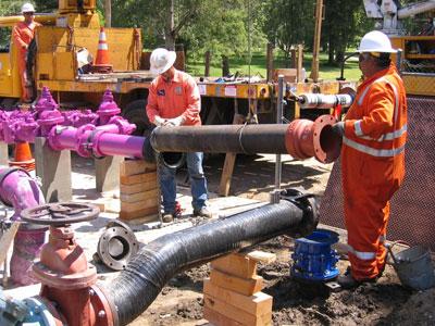 LADWP Crew members installing recycled water purple pipe