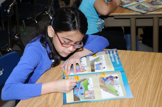 Student at Granada Elementary School going through an activity in the "Paths for Electricity" workbook.