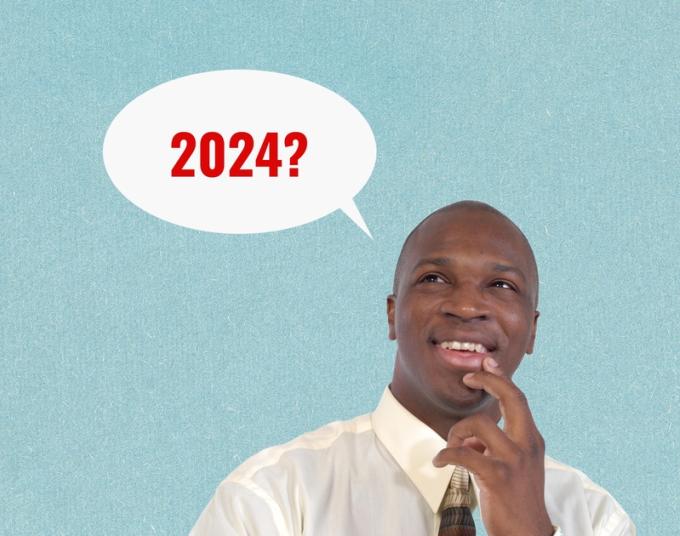 A smiling man beside a word bubble that says “2024?”