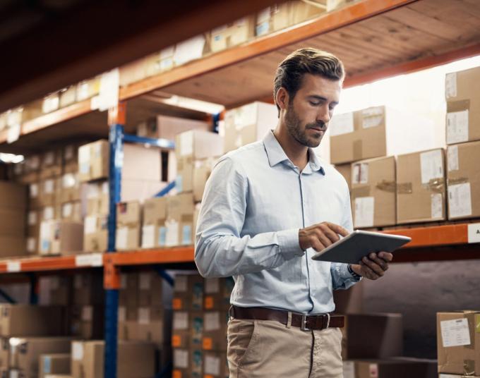 person in a warehouse with boxes