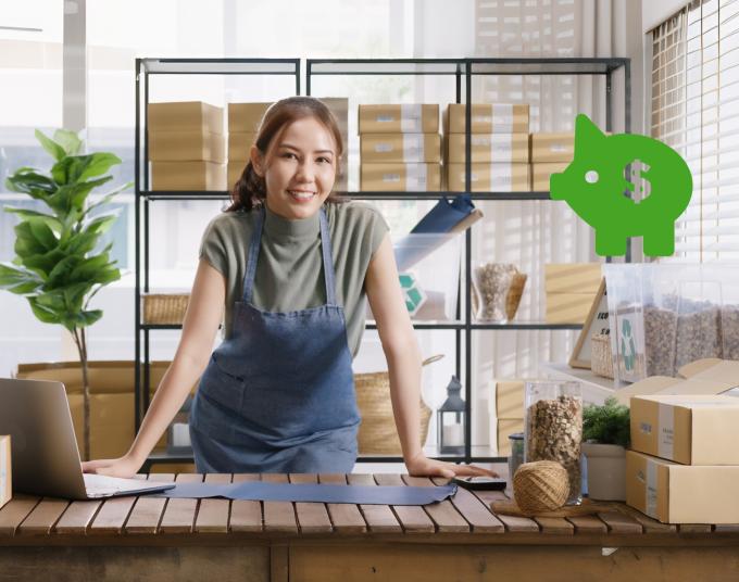 Woman leaning on counter with boxes
