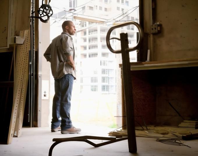 man standing near window