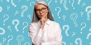 woman standing with question marks in background