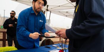 LADWP staff interacting with visitor in an event booth