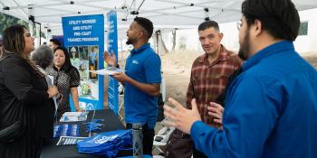 LADWP staff interacting with visitor in an event booth
